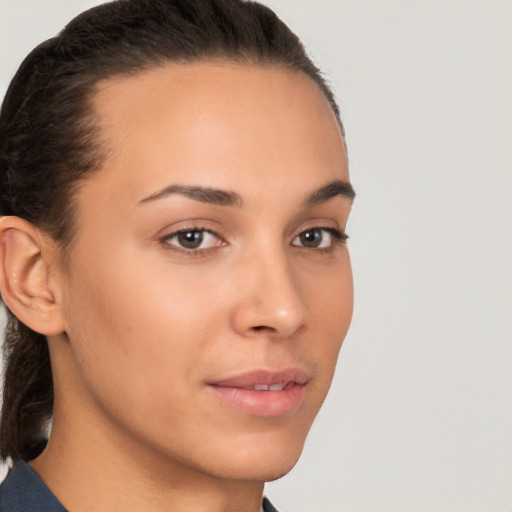 Neutral white young-adult female with short  brown hair and brown eyes