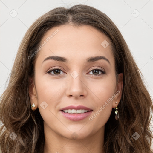 Joyful white young-adult female with long  brown hair and green eyes