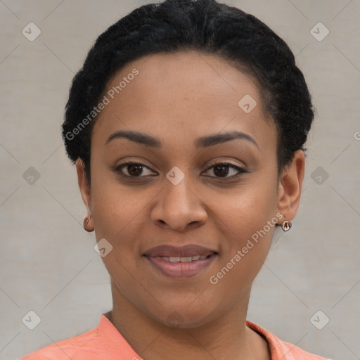 Joyful black young-adult female with short  brown hair and brown eyes