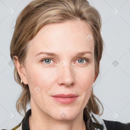 Joyful white young-adult female with medium  brown hair and blue eyes