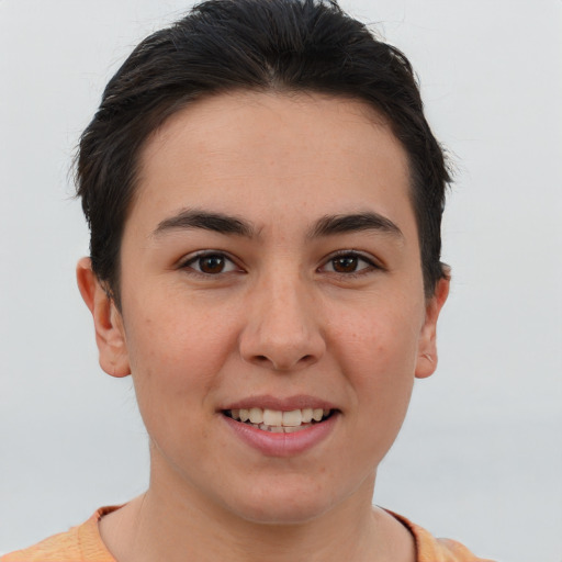 Joyful white young-adult female with short  brown hair and brown eyes