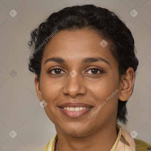 Joyful black young-adult female with short  brown hair and brown eyes