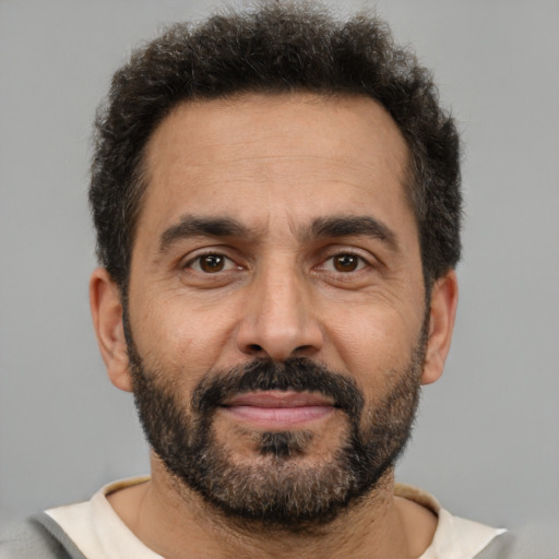 Neutral latino adult male with short  brown hair and brown eyes
