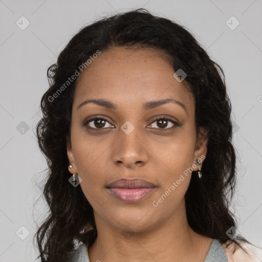 Joyful black young-adult female with long  brown hair and brown eyes