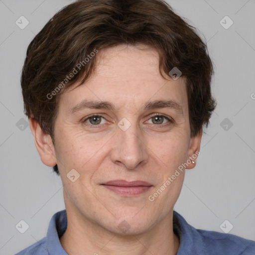 Joyful white adult male with short  brown hair and grey eyes