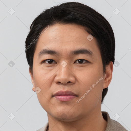 Joyful asian young-adult male with short  black hair and brown eyes