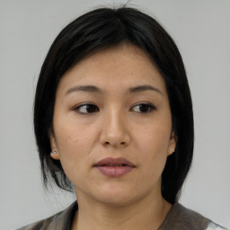 Neutral asian young-adult female with medium  black hair and brown eyes