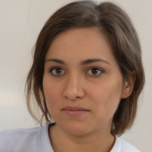 Neutral white young-adult female with medium  brown hair and brown eyes