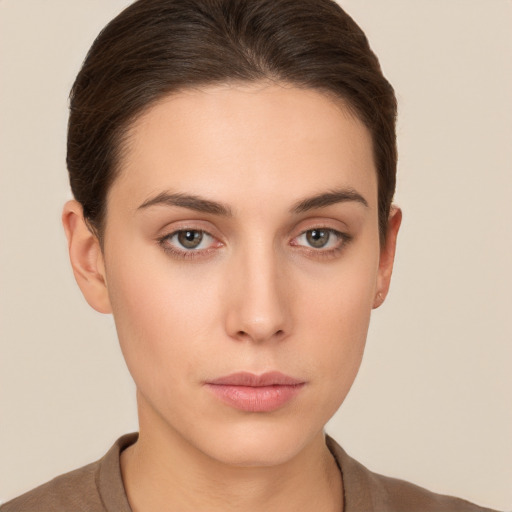 Neutral white young-adult female with short  brown hair and brown eyes