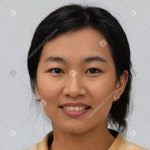 Joyful asian young-adult female with medium  black hair and brown eyes