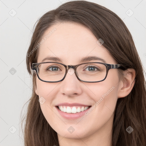 Joyful white young-adult female with long  brown hair and blue eyes