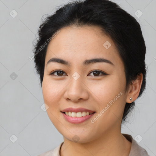 Joyful asian young-adult female with medium  brown hair and brown eyes