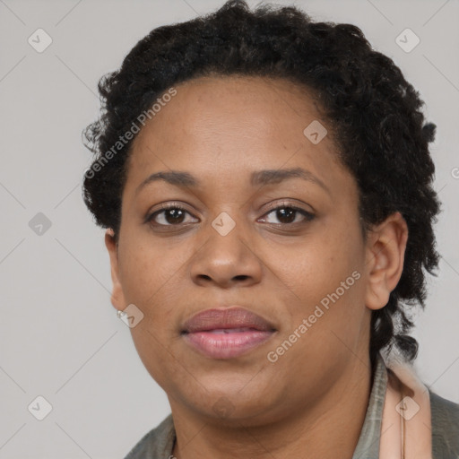 Joyful black adult female with short  brown hair and brown eyes