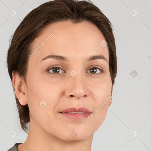 Joyful white adult female with medium  brown hair and brown eyes