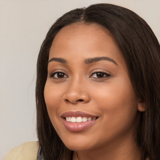 Joyful white young-adult female with long  brown hair and brown eyes