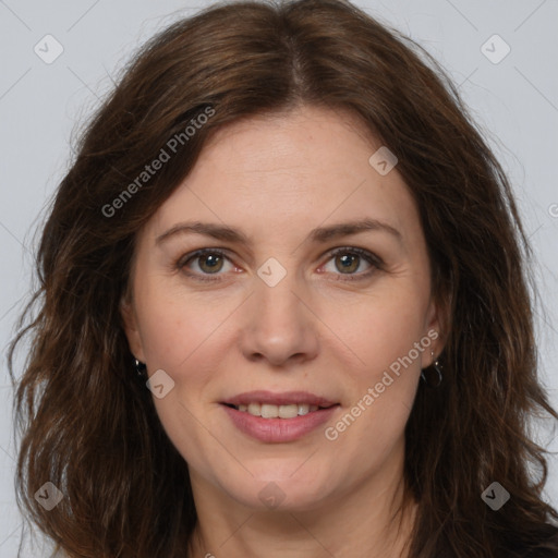 Joyful white adult female with long  brown hair and brown eyes