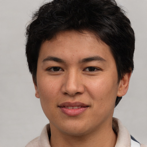 Joyful asian young-adult female with short  brown hair and brown eyes