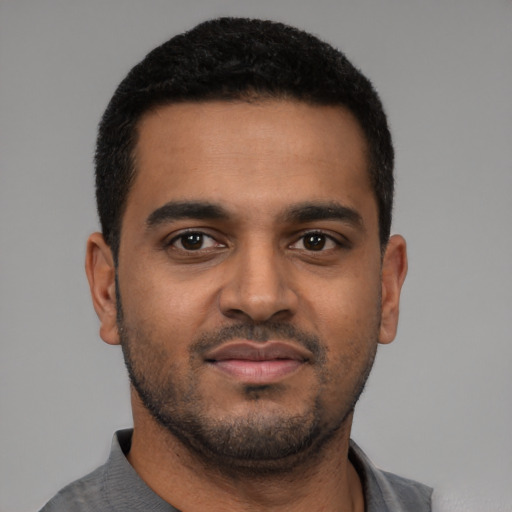 Neutral black young-adult male with short  brown hair and brown eyes