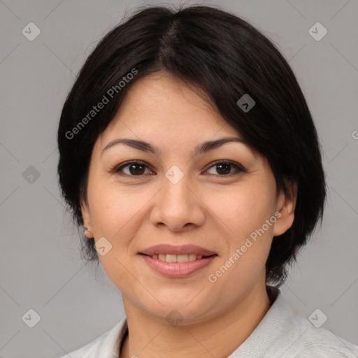 Joyful asian adult female with medium  brown hair and brown eyes