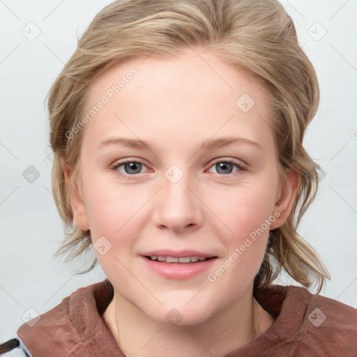 Joyful white young-adult female with medium  brown hair and blue eyes