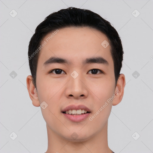 Joyful asian young-adult male with short  black hair and brown eyes