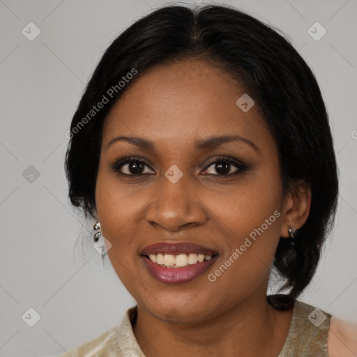 Joyful black adult female with medium  brown hair and brown eyes