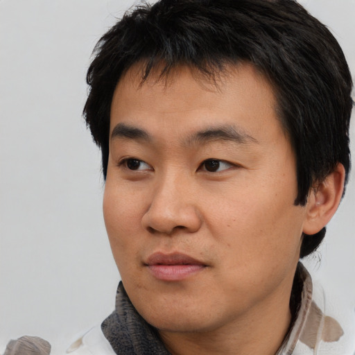 Neutral asian young-adult male with short  brown hair and brown eyes