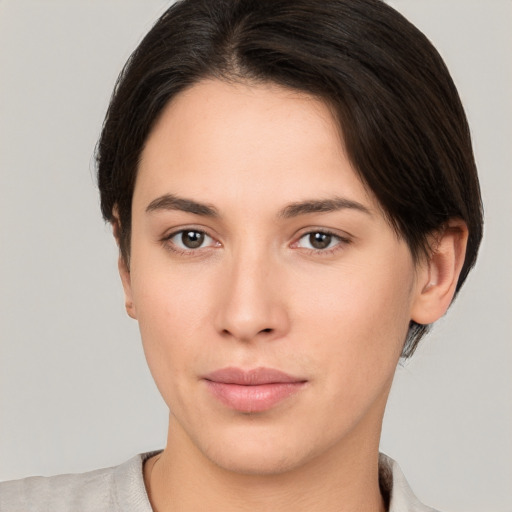 Neutral white young-adult female with short  brown hair and brown eyes