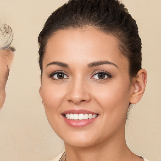 Joyful white young-adult female with short  brown hair and brown eyes