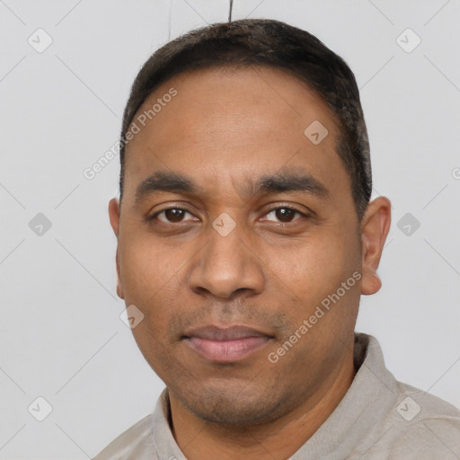 Neutral white young-adult male with short  black hair and brown eyes