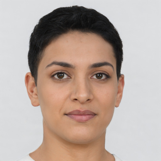 Joyful latino young-adult female with short  black hair and brown eyes