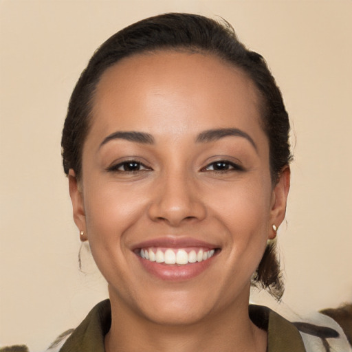 Joyful white young-adult female with medium  brown hair and brown eyes