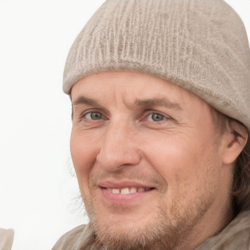 Joyful white adult male with short  brown hair and grey eyes