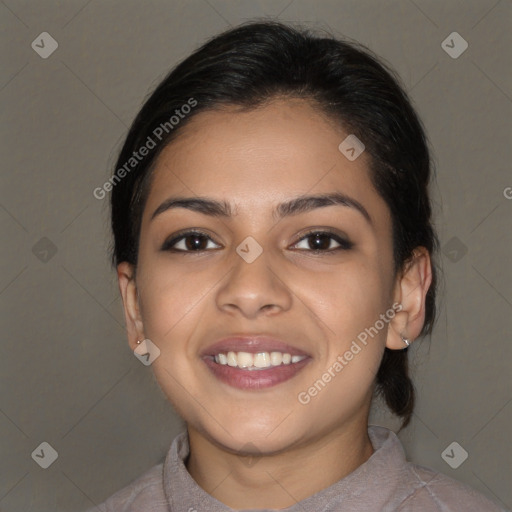 Joyful latino young-adult female with medium  brown hair and brown eyes