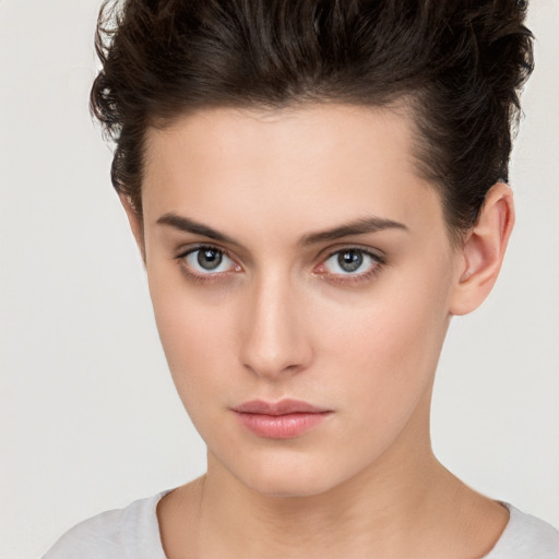 Neutral white young-adult female with short  brown hair and brown eyes