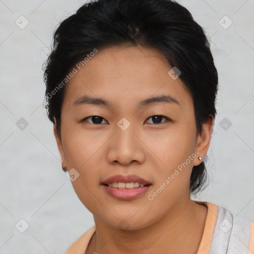 Joyful asian young-adult female with short  brown hair and brown eyes