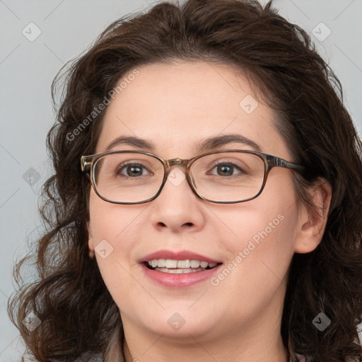 Joyful white adult female with medium  brown hair and blue eyes