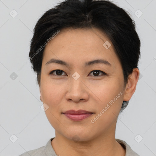 Joyful asian young-adult female with short  brown hair and brown eyes