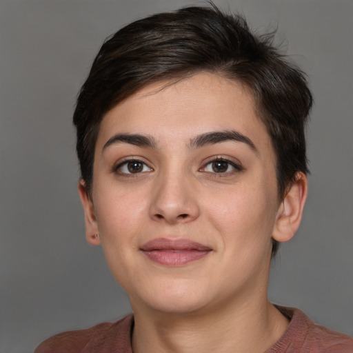 Joyful white young-adult female with short  brown hair and brown eyes