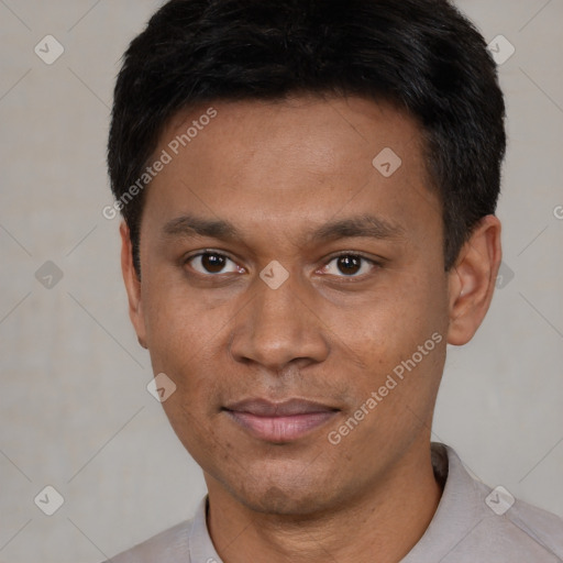 Joyful asian young-adult male with short  black hair and brown eyes