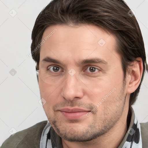 Joyful white adult male with short  brown hair and brown eyes