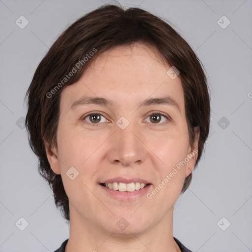 Joyful white adult female with medium  brown hair and brown eyes