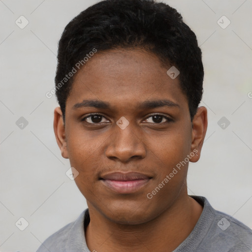 Joyful black young-adult male with short  black hair and brown eyes