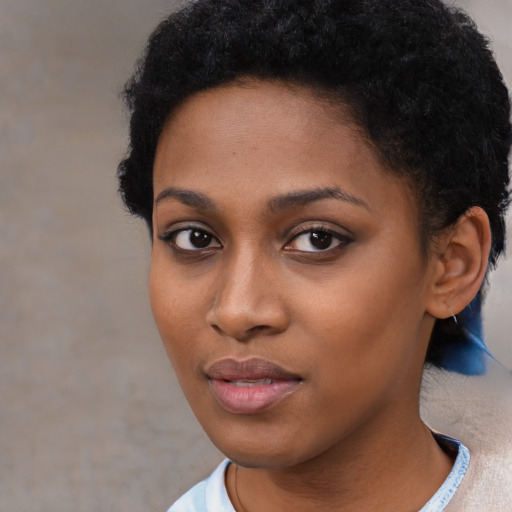 Neutral black young-adult female with short  black hair and brown eyes
