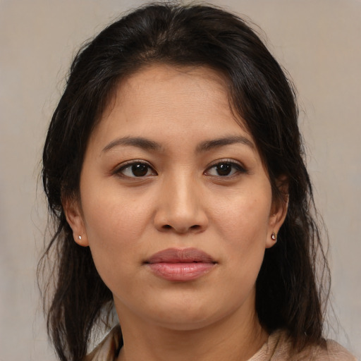 Joyful asian young-adult female with medium  brown hair and brown eyes