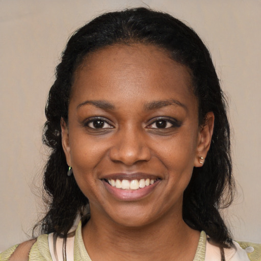 Joyful black young-adult female with medium  black hair and brown eyes