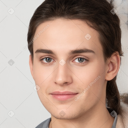 Joyful white young-adult male with medium  brown hair and brown eyes