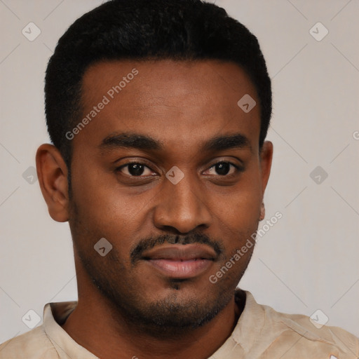 Joyful black young-adult male with short  black hair and brown eyes