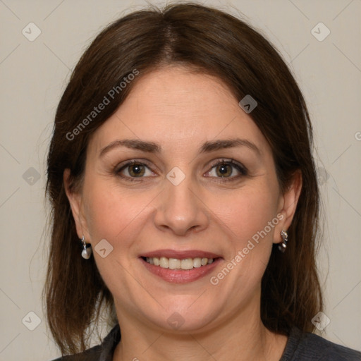 Joyful white adult female with medium  brown hair and grey eyes