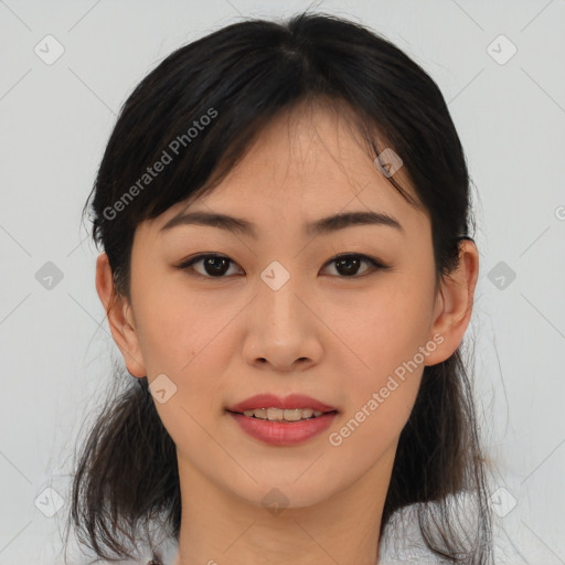 Joyful asian young-adult female with medium  brown hair and brown eyes